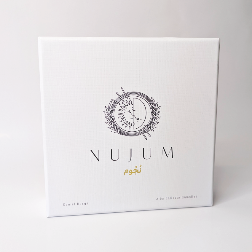 Front view of the NUJUM board game box featuring a minimalist celestial logo, Arabic script for 'stars', and the names of creators Daniel Rosga and Alba Ballesta González on a white background