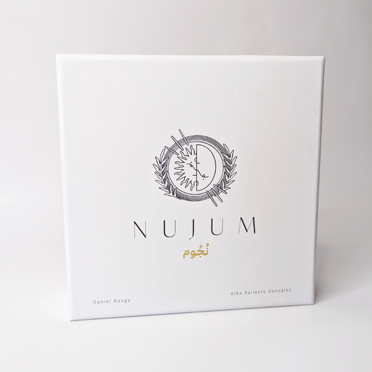 Front view of the NUJUM board game box featuring a minimalist celestial logo, Arabic script for 'stars', and the names of creators Daniel Rosga and Alba Ballesta González on a white background